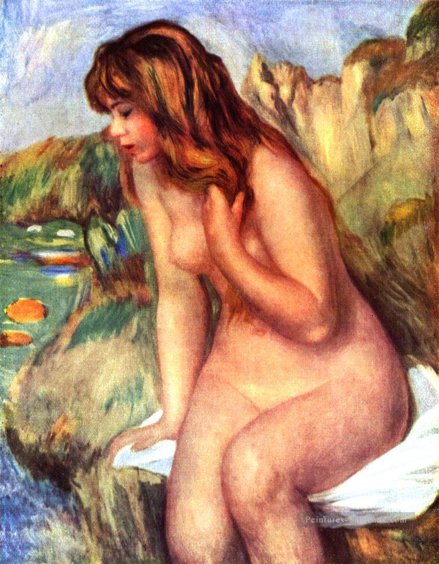 baigner sur un rocher Pierre Auguste Renoir Peintures à l'huile